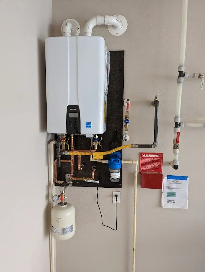 Professional plumber installing copper piping in a Helena home